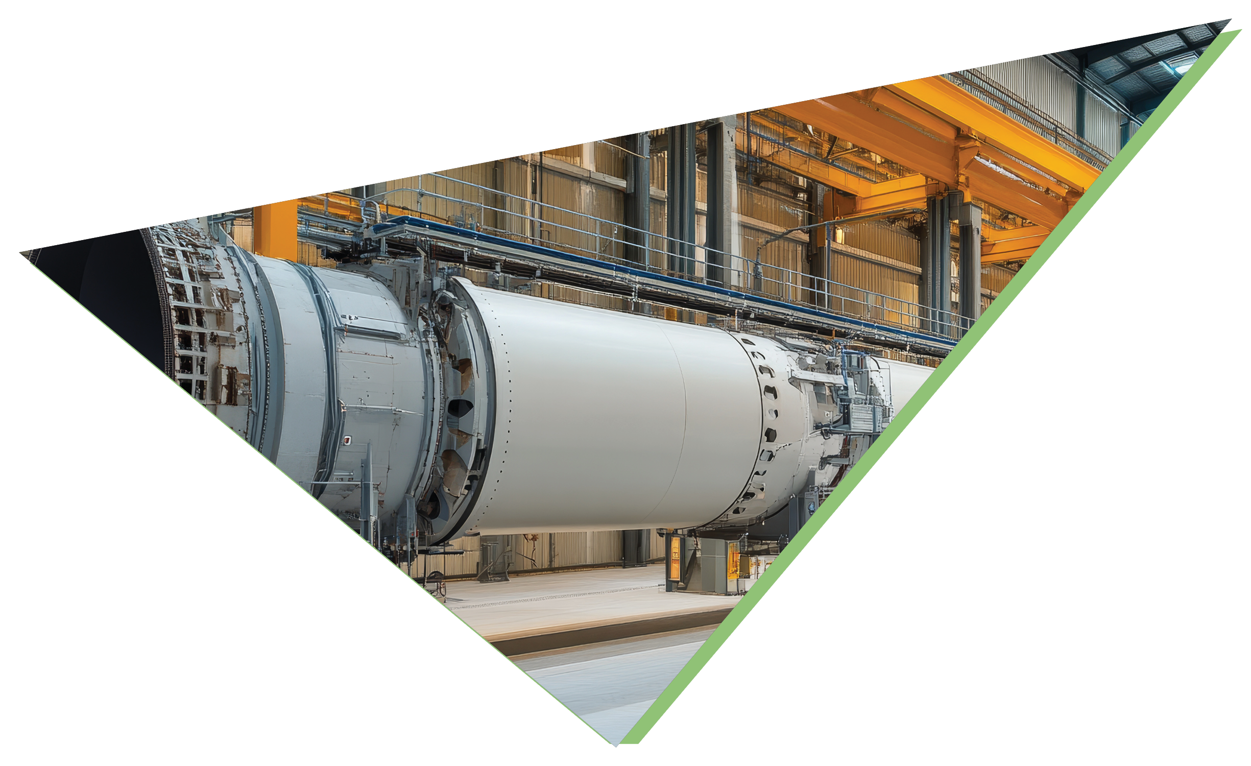 Large industrial rotary kiln in a plant hall with overhead crane